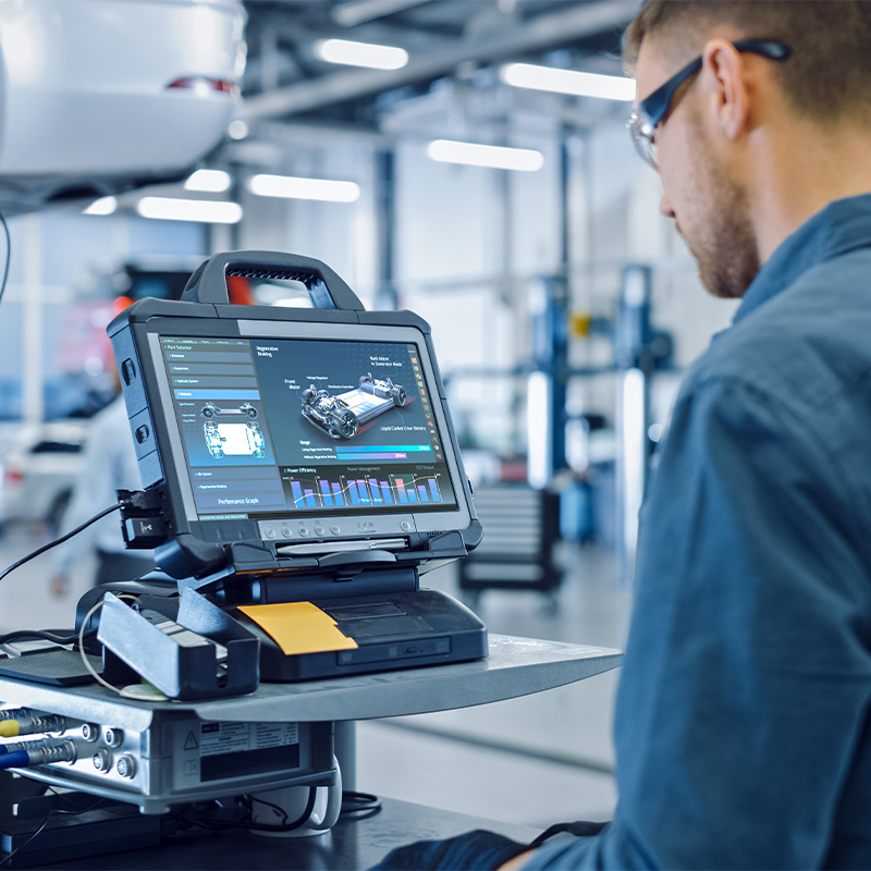 Mobility solution Worker overseeing the manufacturing of a vehicle