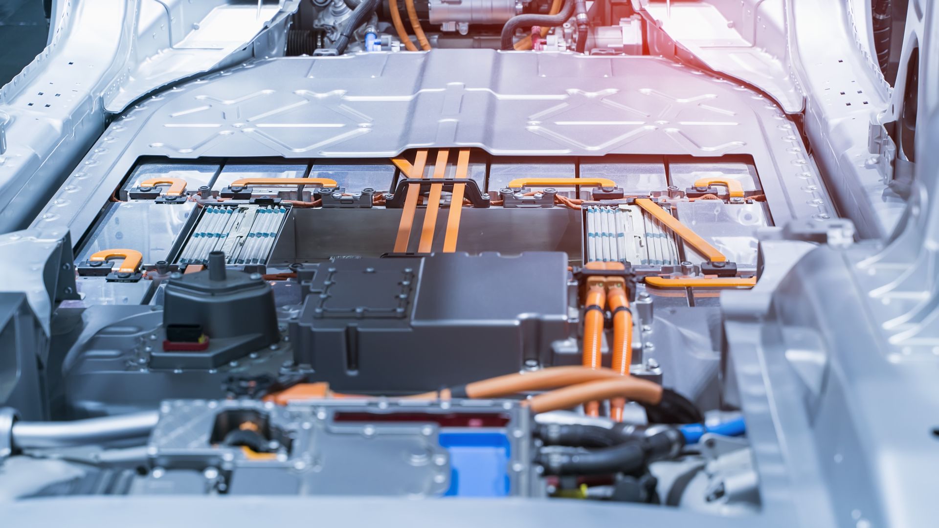 High-voltage electric vehicle battery with battery modules and busbar module connectors visible