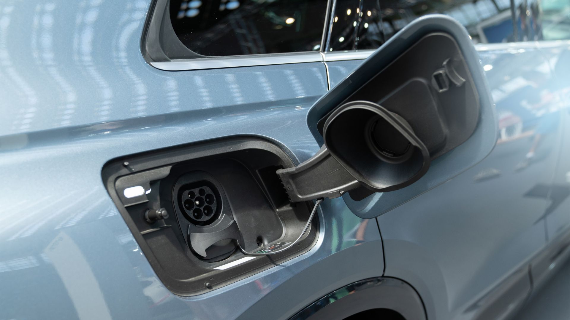 Charging port and opened up charging port door of an electric vehicle
